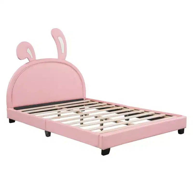 Lit plateforme rembourré en cuir pleine grandeur avec tête de lit à oreilles et ornement de lapin pour enfants, rose