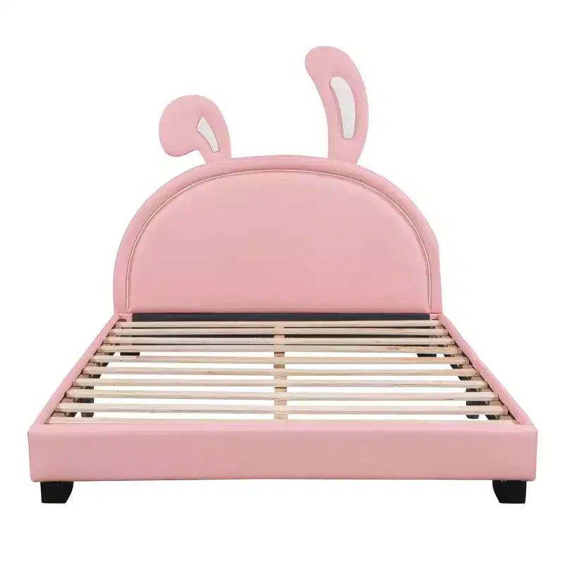 Lit plateforme rembourré en cuir pleine grandeur avec tête de lit à oreilles et ornement de lapin pour enfants, rose