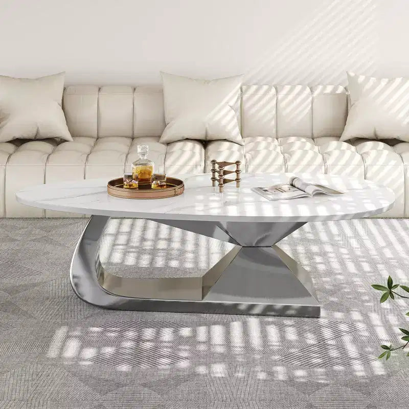Table basse à plateau en céramique avec piètement contemporain en acier inoxydable - Une pièce maîtresse durable et élégante pour votre salon.