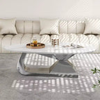 Table basse à plateau en céramique avec piètement contemporain en acier inoxydable - Une pièce maîtresse durable et élégante pour votre salon.