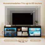 Meuble TV Costway avec prises de courant, lumières LED réglables et placard de rangement pour téléviseurs jusqu'à 85 pouces, noir/blanc