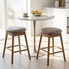 Lot de 4 tabourets de bar pivotants Costway 63,5 cm avec pieds en bois massif et repose-pieds