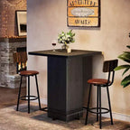 Table de bar carrée Lantine, table de bistrot/pub haute de 99,99 cm en bois avec repose-pieds en métal pour salle à manger, café, cocktail, salon, petits espaces
